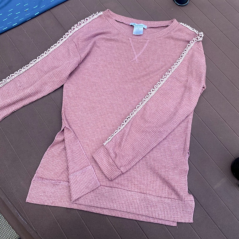 Pink sweater with slits down the arms